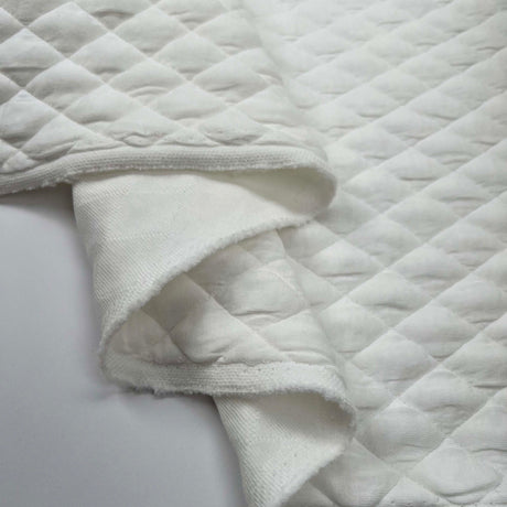 Urban Quilted Jersey Ivory Polyester Viscose Elastane Knitted Diamond Quilt Fabric Fold