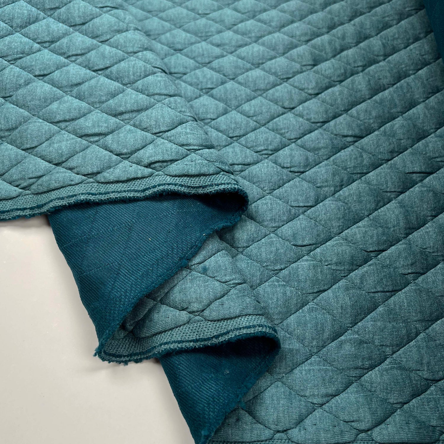Urban Quilted Jersey Teal Polyester Viscose Elastane Knitted Diamond Quilt Fabric Fold