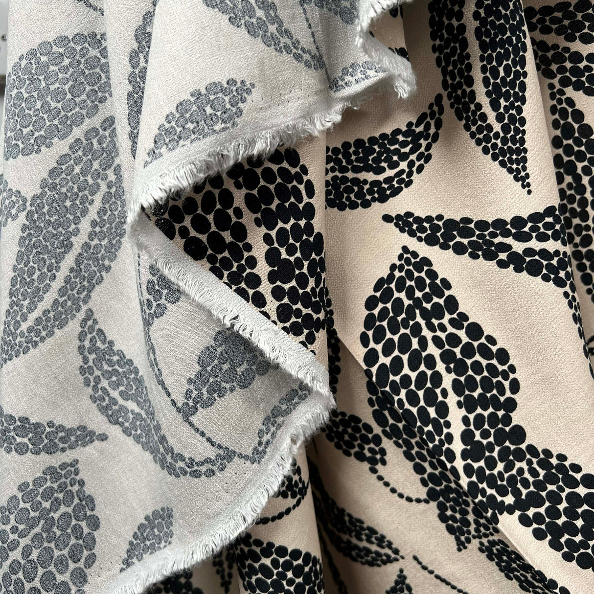 Beige Black Leaf Print Dress Fabric | Viscose Marocain Spot The Sand Hang