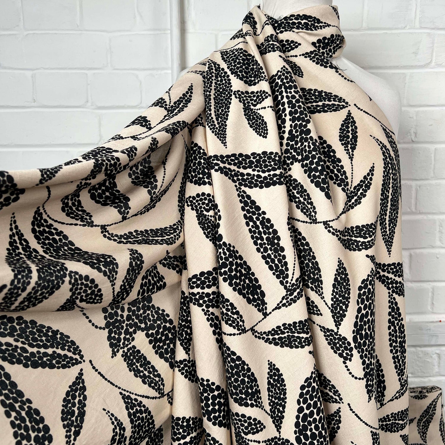 Beige Black Leaf Print Dress Fabric | Viscose Marocain Spot The Sand Mannequin