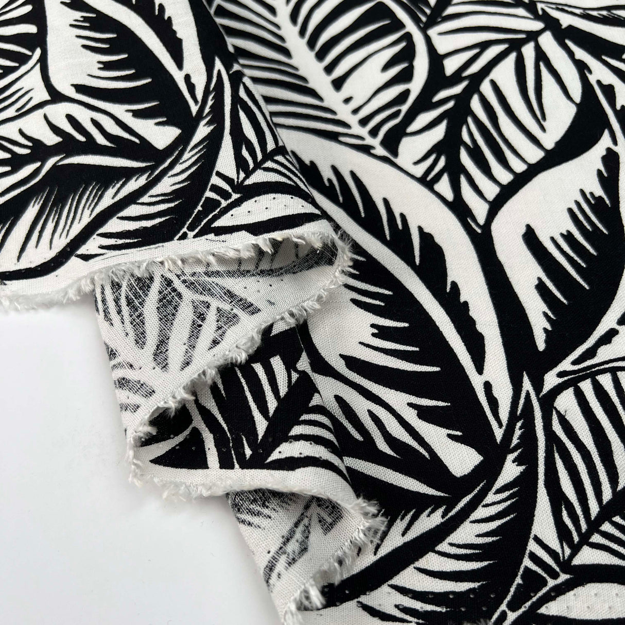 Viscose_Slub_Monochrome_Jungle_Leaf_Rayon_Spandex_Black_White_150gsm_Dress_Fabric_Fold