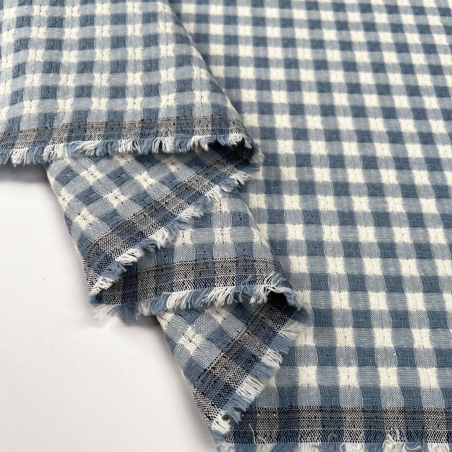 Washed_Cotton_Gingham_Jacquard_Dusty_Blue_Check_White_Woven_Shirting_Fabric_Fold