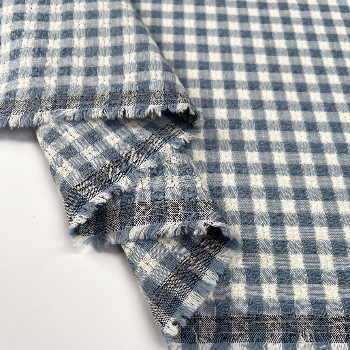 Washed_Cotton_Gingham_Jacquard_Dusty_Blue_Check_White_Woven_Shirting_Fabric_Fold