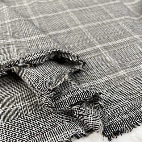 A Mixture Polyester Viscose Linen Black Cream Check Suiting Fabric Fold