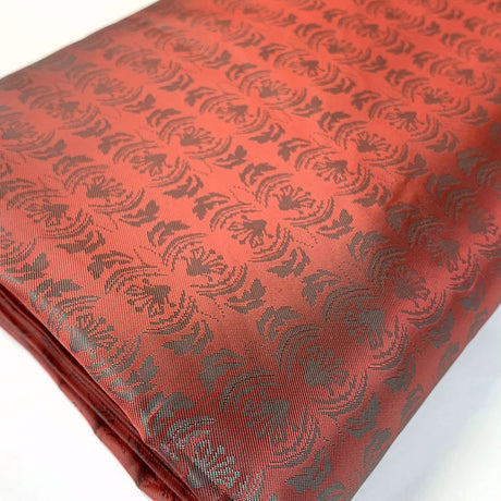 E210 Mirrored Red Pale Green Mirrored Leaf Design Pattern Lining Fabric Fabric Photo