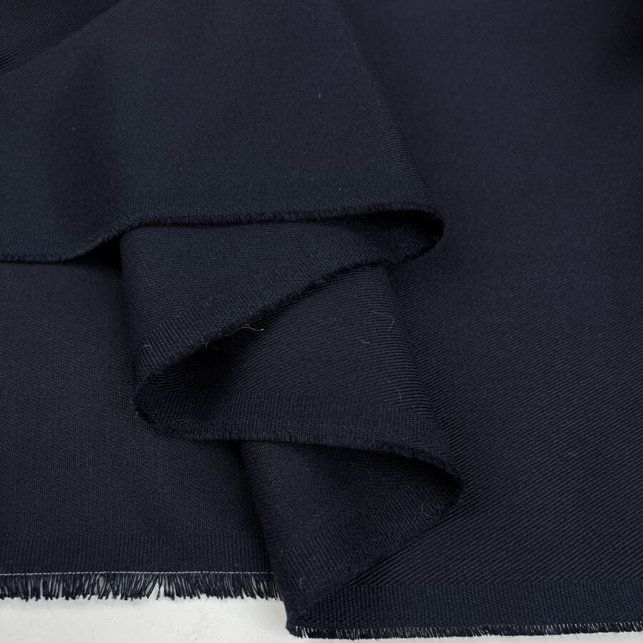 Fighting Back British Wool Cotton Navy Plain Woven Suiting Fabric Fold