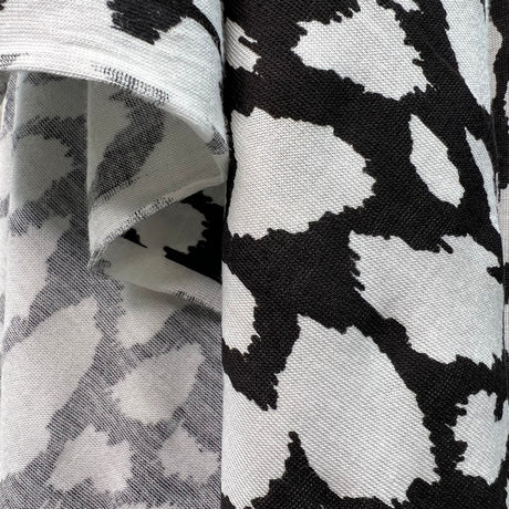 Finest Splodge Black And White Viscose Lycra Knitted Jersey Dress Fabric Fold