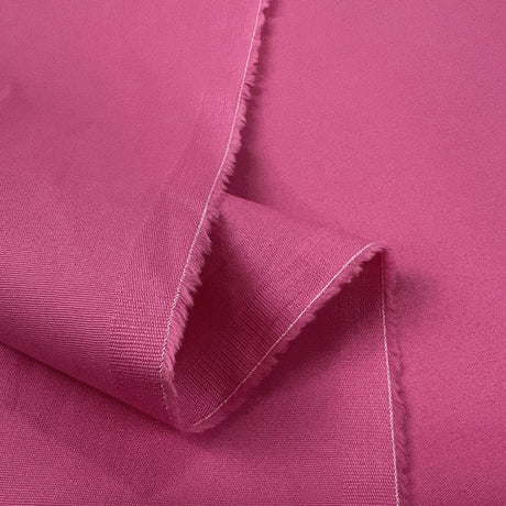 Fuchsia Flex Pink Cotton Elastane Woven Suiting Fabric Fold