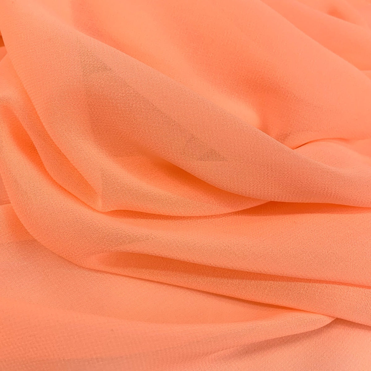 Georgette Coral Salmon Pink Polyester Dress Fabric Fold