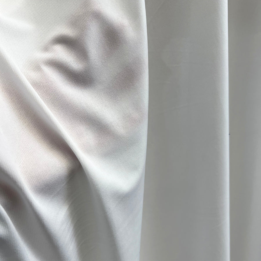 Ity Matt Ivory Jersey Polyester Dressmaking Fabric Hand