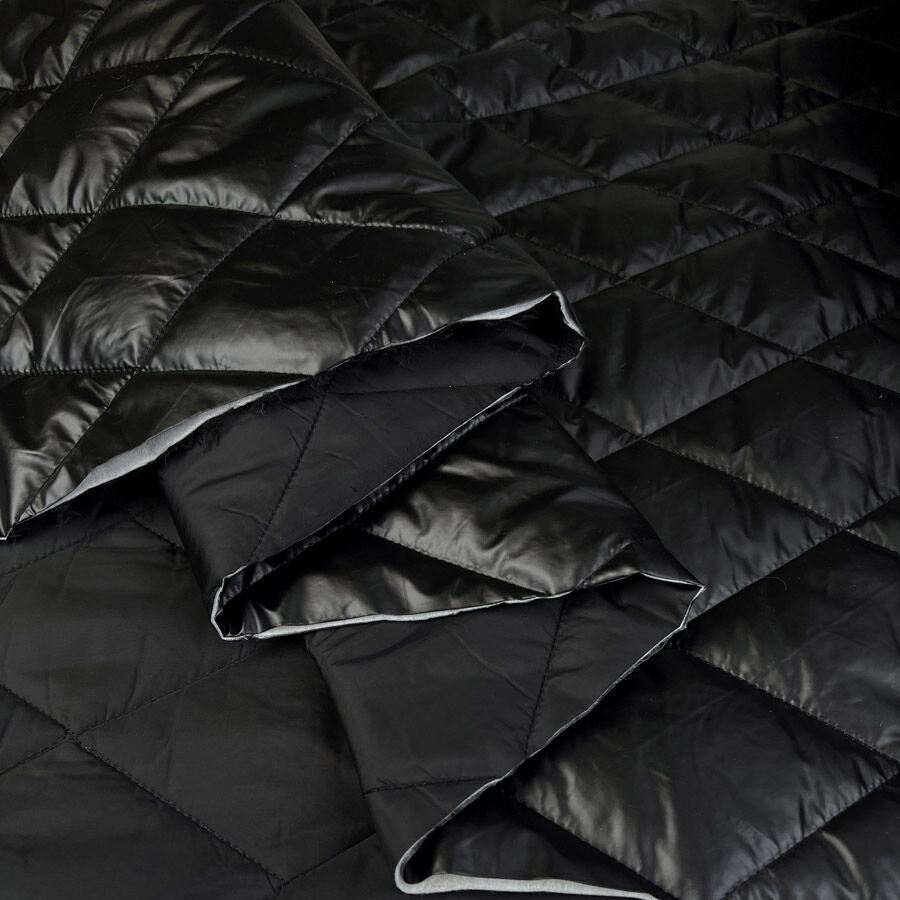 Metallic Marvel Black Shiny Polyester Quilted Black Coating Fabric Fold 4D0937D7 Cf8F 4D35 B9Dc 6188B190Eb18