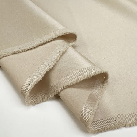 Mystique Champagne Polyester Matte Satin Gold Plain Woven Dress Fabric Fold