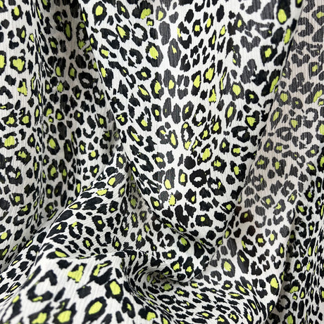 Polyester Chiffon Dress Fabric Neon Green Leopard Spot Punch Close Up