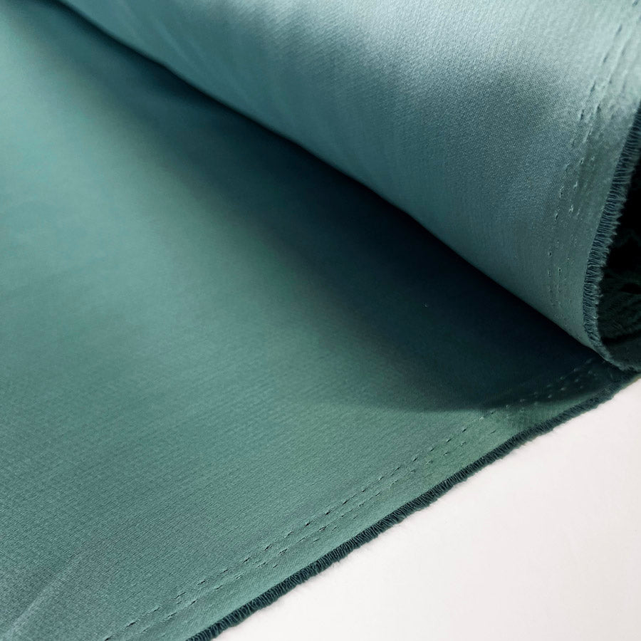 Polyester Satin Back Crepe Dress Fabric Liquid Patina Green Roll