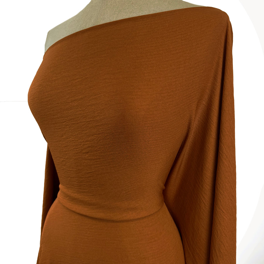 Saffron Orange Tan Polyester Knitted Jersey Fabric Side