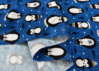 Stof cotton jersey pablo penguin print blue oeko tex elastane knitted fabric fold