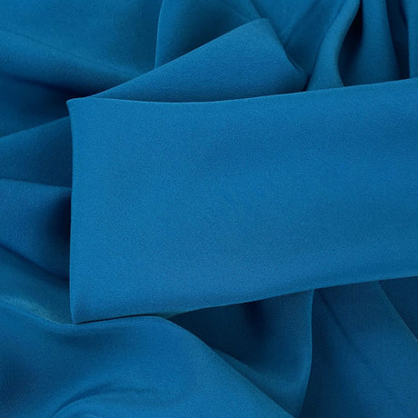 Superior Satin Crepe Peacock Deep Blue Polyester Crepe Dress Fabric Close Up Fabric Photo