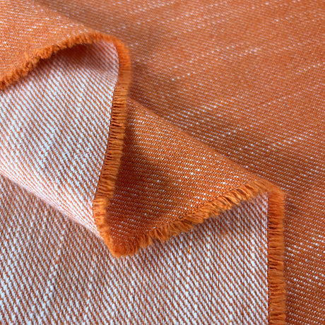 Tangerine Dream Orange White Polyester Cotton Viscose Trousering Fabric Fold