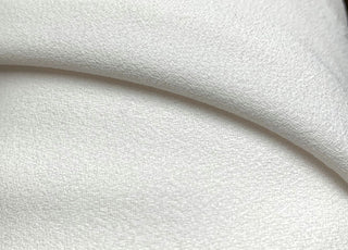 Triple Crepe Ivory Pale Natural Ivory Polyester Triple Heavyweight Crepe Close Up Drape Fabric Photo