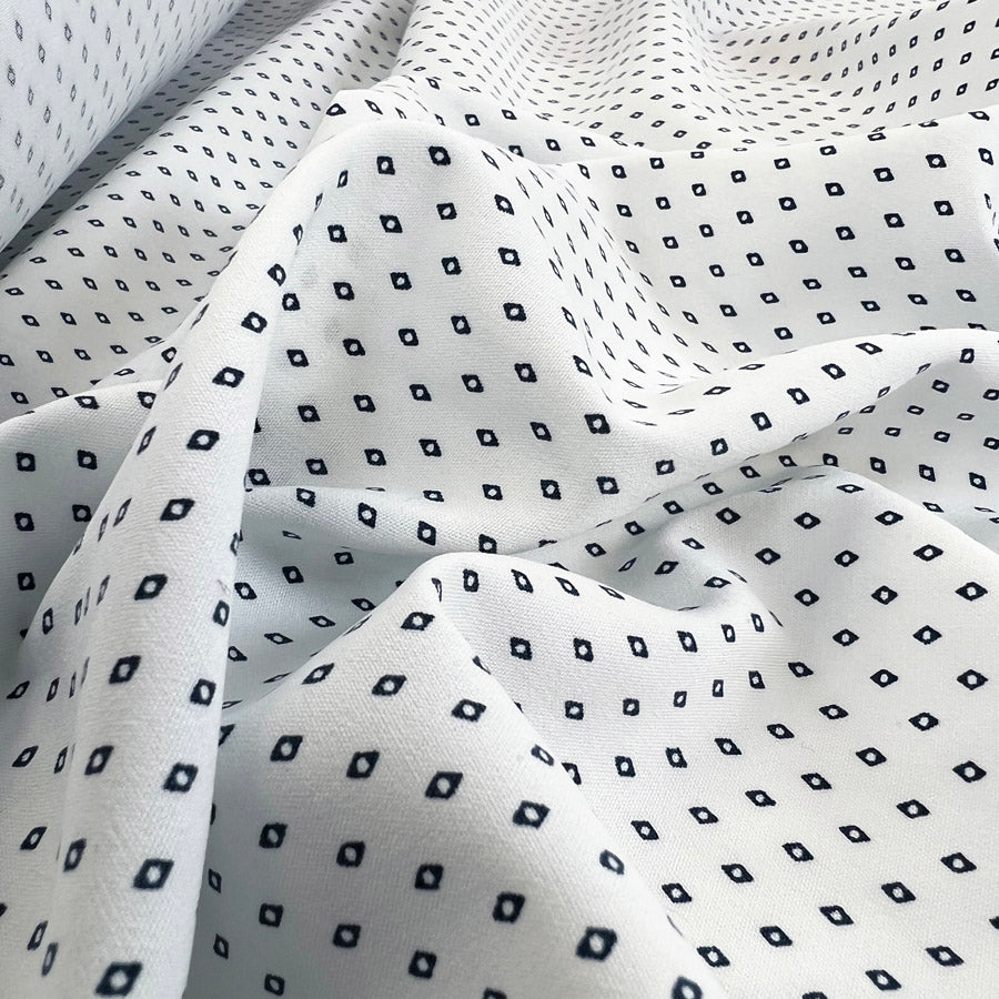 White polyester dress fabric navy diamonds oh so s
