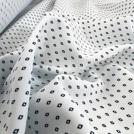 White polyester dress fabric navy diamonds oh so s