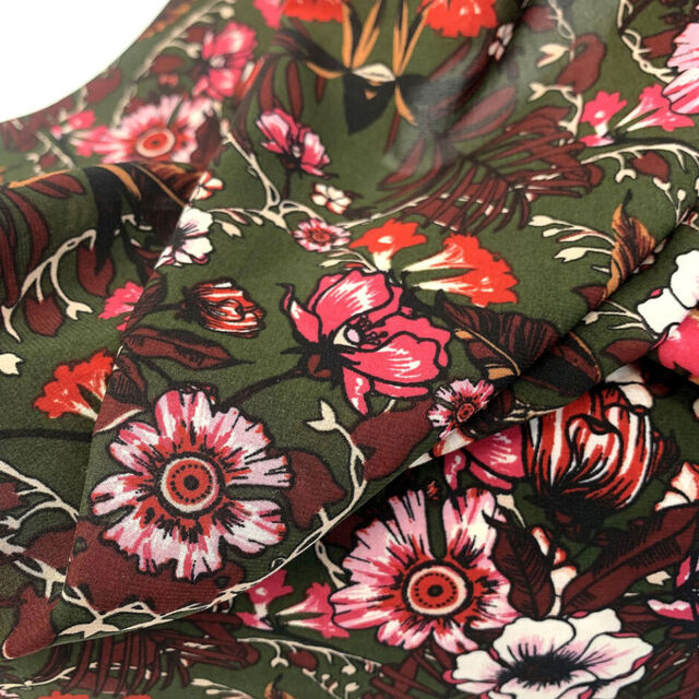 at-midnight-autumn-garden-olive-green-polyester-maroon-pink-red-rust-floral-dress-fabric-close-up-fabric-photo