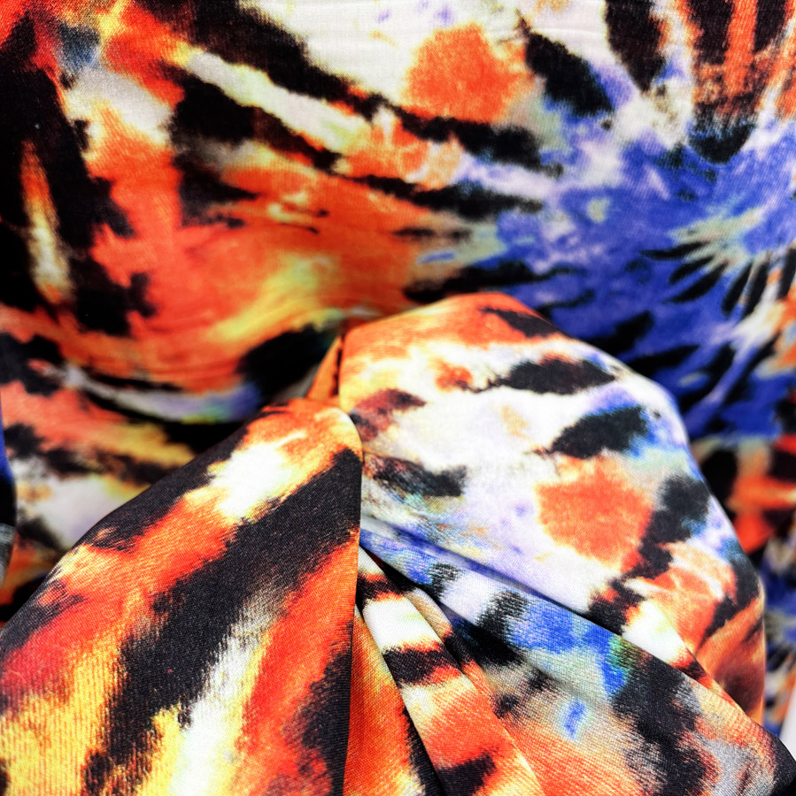 https://www.croftmill.co.uk/images/pictures/2022/06-june-2022/digital_viscose_dress_fabric_tie-dye_festival_download_orange_cu2.jpg?v=c3e98ae9