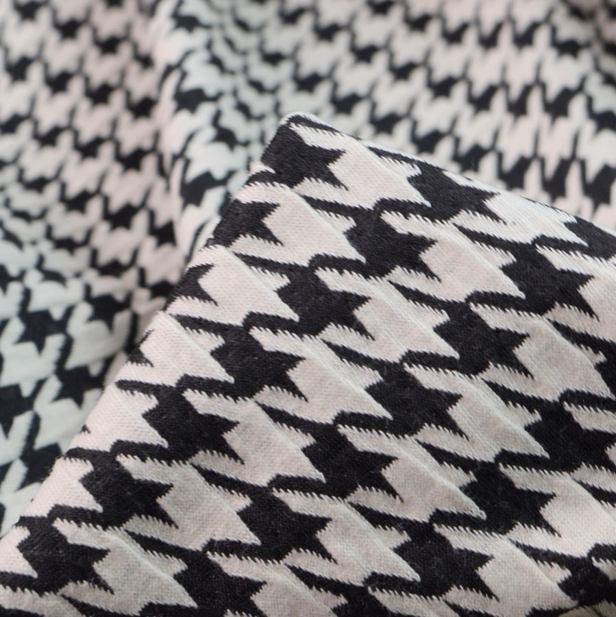 Fabric Cotton//elastane Black cloud print knit medium weight knit.