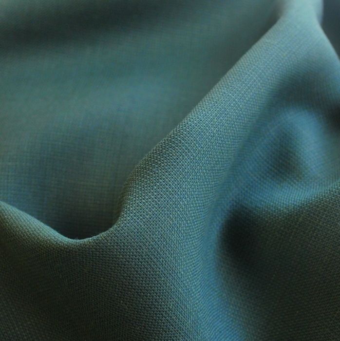 Gone Funny jade poly wool suiting fabric close up
